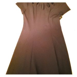 A Black Dress With Cutout Detail